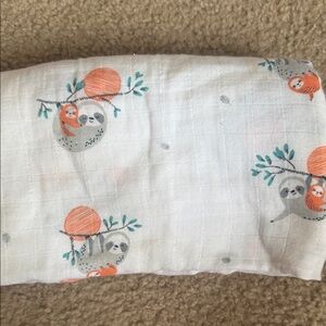 Angel Dear White Muslin Swaddle with Gray Sloths and Orange Accents